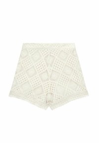 Bermuda in pizzo color avorio con un motivo geometrico, orlo scallop e vita elastica, caratterizzate da una trama lavorata complessa.
