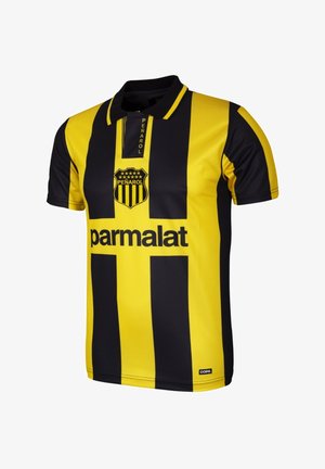 Zwart-gele gestreepte voetbalshirt met een kraag, voorzien van het "Peñarol" logo en de tekst "parmalat" op de voorzijde. Gemaakt van polyester.