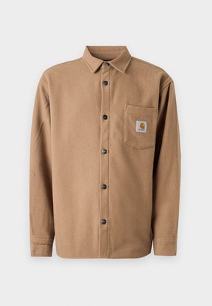 Brun flannel skjorte med knapper, lange ærmer, enkelt brystlomme med logopatch og sorte knapper. Blød tekstur.