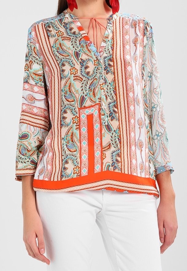 Multicolored blouse featuring a paisley and striped pattern, V-neck with ties, three-quarter sleeves, and an orange accent at the hem.