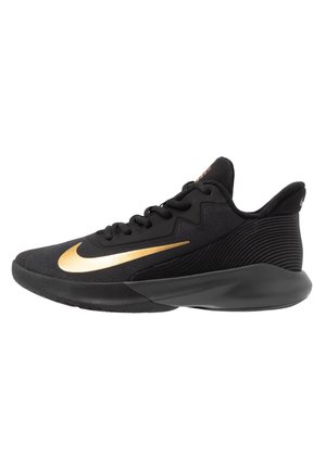 Black athletic sneaker with gold Nike swoosh, black sole, and lace-up design, viewed from the side on a white background.