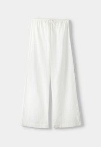 Vita vida byxor i bomull med ett strukturerat, broderat mönster. Har en elastisk midjeband och en dragsko-detalj.