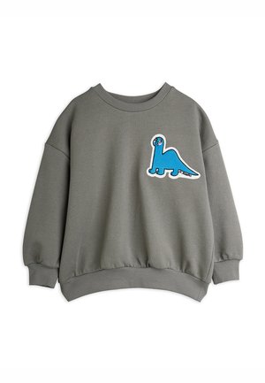 Sweatshirt gris avec un col rond, des poignets côtelés et un grand patch de dinosaure bleu sur la poitrine gauche. Matière douce en mélange de coton.
