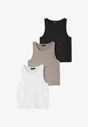 Trois débardeurs sans manches côtelés en noir, beige et blanc, disposés en chevauchement sur un fond blanc.