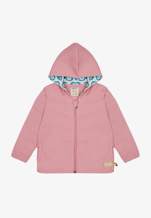 Felpa rosa con texture e zip frontale, con un motivo floreale blu nella fodera interna e etichette laterali verdi e multicolori.