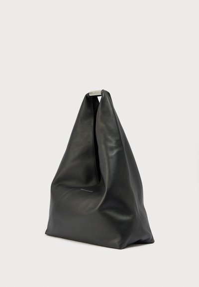 Black soft leather tote bag with a triangular shape and silver metal clasp at the top, placed on a plain white background.