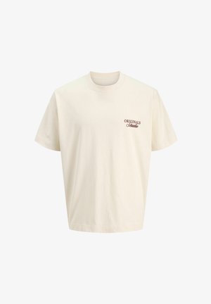 Cremfarbendes Baumwoll-T-Shirt mit kurzen Ärmeln, Rundhalsausschnitt und einem kleinen braunen "ORIGINALS"-Logo auf der linken Brust.