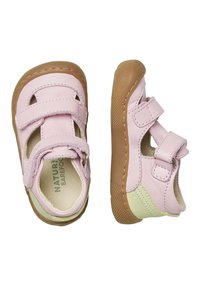 Pink leather shoes with two Velcro straps, a tan rubber sole, and a light green accent. Features cut-out details for breathability.