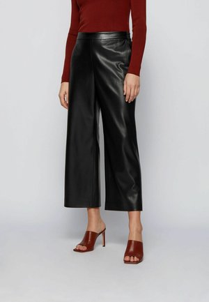 TAOMIE - Pantaloni di pelle - black