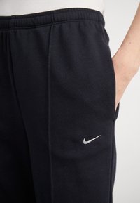 Nike Sportswear Tracksuit bottoms - black