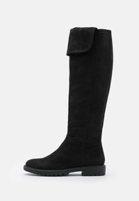 Botas de ante negro hasta la rodilla con suela plana y parte superior plegable, que presentan una textura suave y un diseño sencillo.