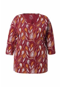 Burgundy pitkähihaisissa puserossa on oransseja ja valkoisia abstrakteja lehtikuvioita ja V-kaula-aukko.