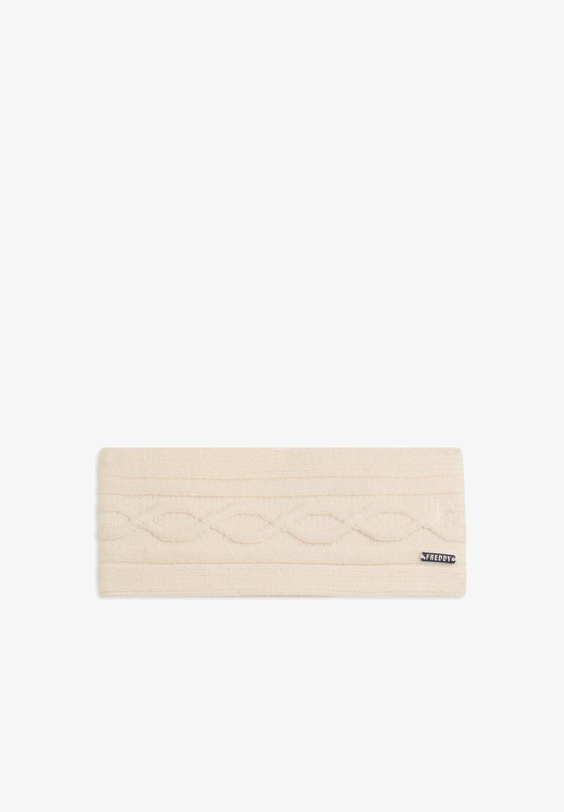 Diadema de color crema hecha de tela texturizada, con patrones en zigzag y un pequeño logo negro en un lateral. Forma rectangular.