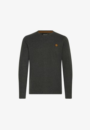 Tumesinine pika varrukaga T-särk, mis on valmistatud pehmest kangast. Omab ümmargust kaelust ja väikest pruuni logo silti rinnal.