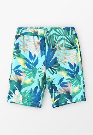 Niebieskie szorty z tropikalnym wzorem liści w odcieniach zieleni, złota i turkusu. Wykonane z lekkiego materiału, zapinane na guzik, z bocznymi kieszeniami.