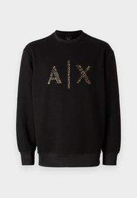 Sudadera negra con cuello redondo, que presenta letras doradas brillantes "AIX" en la parte delantera. Puños y dobladillo elásticos. Material de algodón suave.