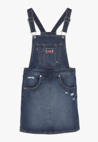 Vestito in denim blu scuro, con spalline regolabili, una tasca frontale e dettagli scoloriti sulla gonna.