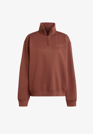 Sudadera de media cremallera marrón hecha de un tejido suave, con un cuello alto y puños acanalados. Sutil logo de adidas en color a juego.