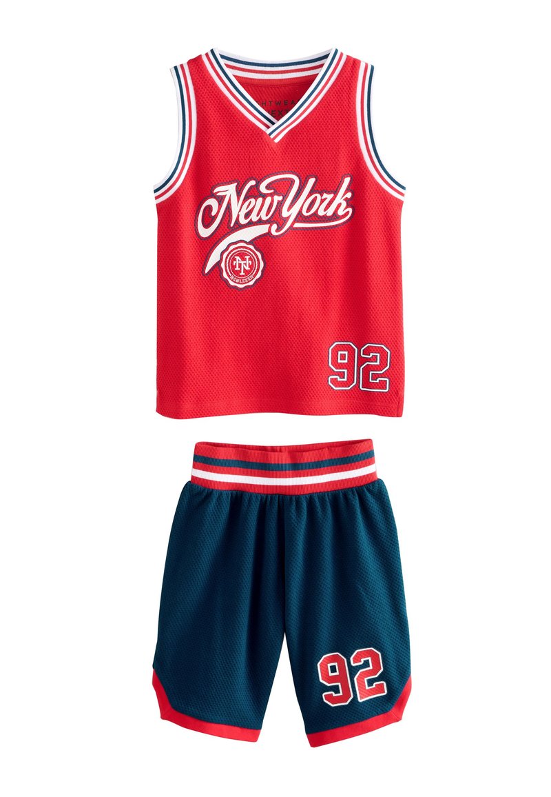 Red sleeveless jersey featuring "New York" in white, paired with dark blue shorts with red trim and the number 92 in white.