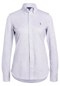 Light purple, long-sleeve button-down shirt made of soft cotton, featuring a classic collar, buttons down the front, and a small logo on the chest.