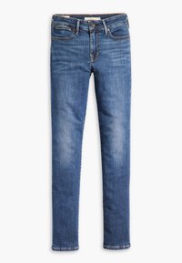 Jean slim en denim bleu avec légère décoloration, fermeture avant par bouton et zip, et design à cinq poches.