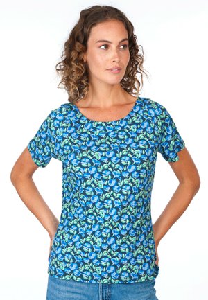 Blue floral short-sleeve shirt with a round neckline, featuring a green leaf pattern on a navy background, made from a light fabric.