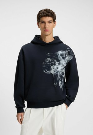 Navy hoodie made of cotton blend, featuring a large white abstract print on the front, with a relaxed fit and ribbed cuffs and hem.