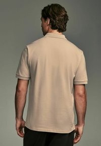 Next Polo - neutral stone
