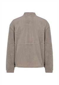 Fleecejacke in sanftem Grau, mit hohem Kragen, langen Ärmeln und einem lockeren Schnitt. Verfügt zudem über seitliche Reißverschlüsse am Saum.