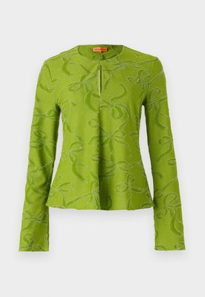 Green long-sleeve top with a rounded neckline, featuring a front keyhole and a textured pattern of swirling lines and bows.
