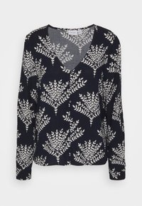 Blusa a maniche lunghe blu navy con scollo a V e motivo a foglie bianche, con chiusura a bottoni e tessuto morbido.
