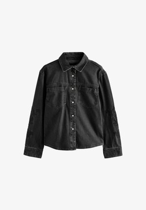 Must mustaheline särk, pikkade varrukatega, kahe rinna-taskuga ja lillelise broderie-detailiga vasakul varrukal. Sisaldab nööpkinnistust ja kraed.