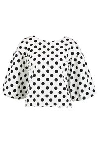 Weißes Oberteil mit schwarzen Polka-Dots, runder Ausschnitt und kurzen Glockenärmeln. Aus leichtem Stoff gefertigt. Kurzes Design.