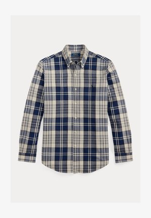 Zila un bēša krāsas pleda raksta garām piedurknēm krekls ar pogājamu apkakli, ar mazu logotipu un izliekta apakšmala. Kokvilnas audums ar mīkstu tekstūru.