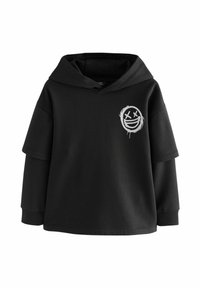 Black oversized hoodie made of cotton blend, featuring a large hood, short sleeves, and a white smiley face graphic on the front.
