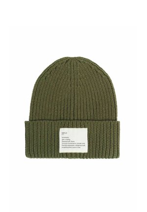Olive green ribbed knit beanie with a folded cuff and a white rectangular label showing text defining the word "SMYLE."