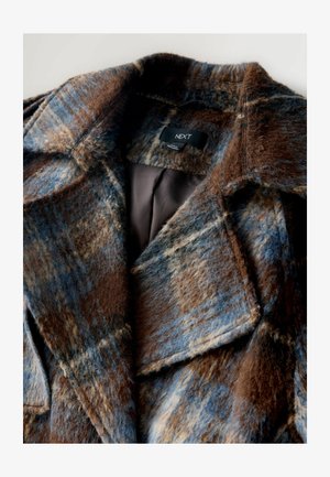 Brown and blue plaid coat made from textured fabric, featuring a wide collar and interior lining in a solid dark color. Brand tag visible.