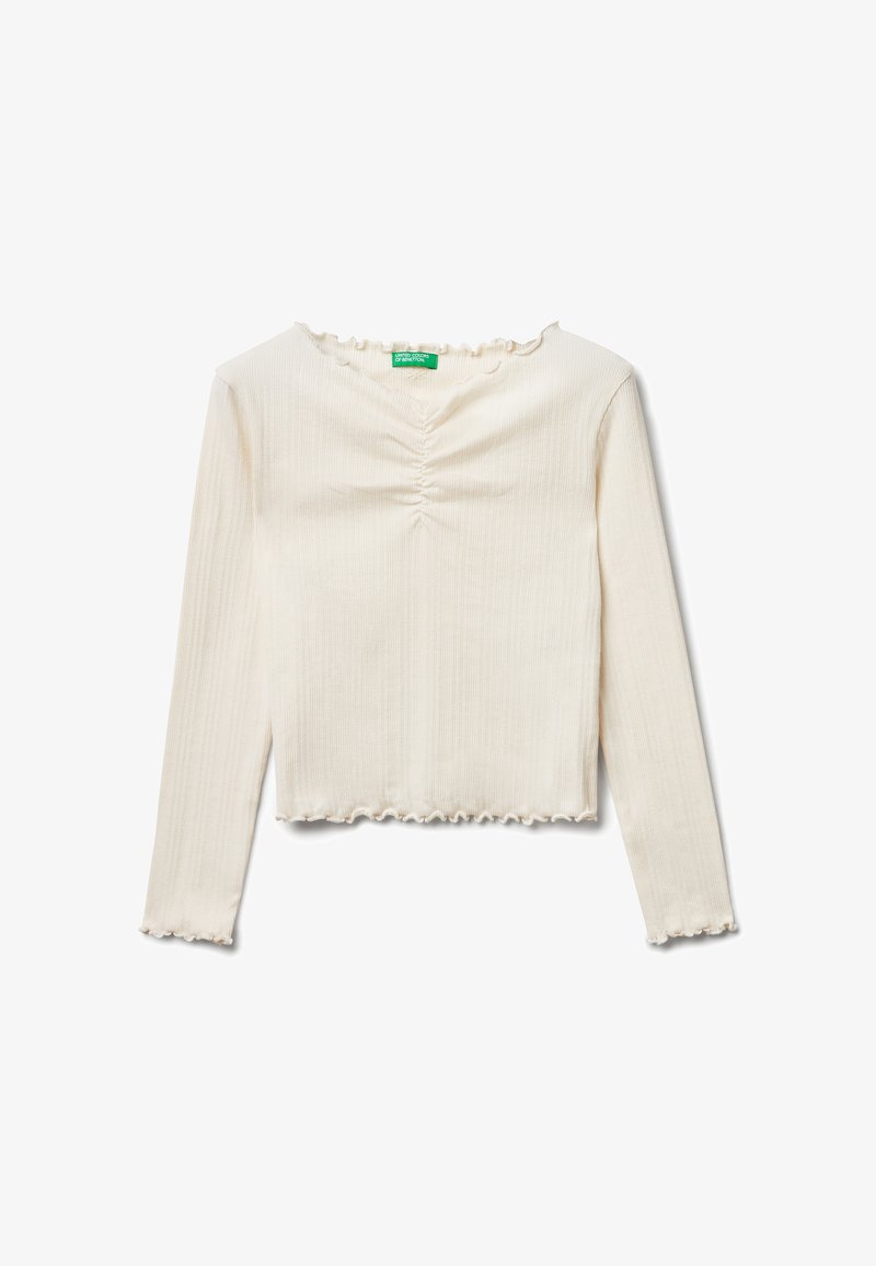 Krémový dlouhý rukáv top s ribovanou texturou, nařaseným středem a volánkovým výstřihem a lemem. Zkrácená délka a přiléhavý střih.