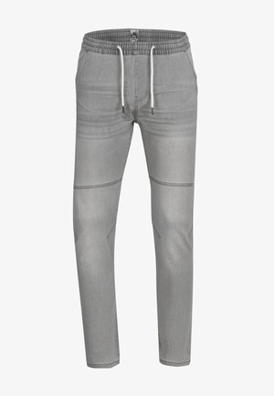 Gray jogger pants made of soft fabric featuring an elastic waistband with drawstrings, tapered legs, and subtle stitching details.