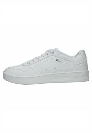 White athletic sneakers with a smooth synthetic upper, padded collar, and flat rubber sole. Features subtle branding on the side and minimal perforations.