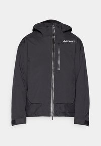 Giacca nera Terrex con cappuccio, cerniera frontale e tasca sul petto. Caratterizzata da un design minimale e tessuto testurizzato con polsini in Velcro.