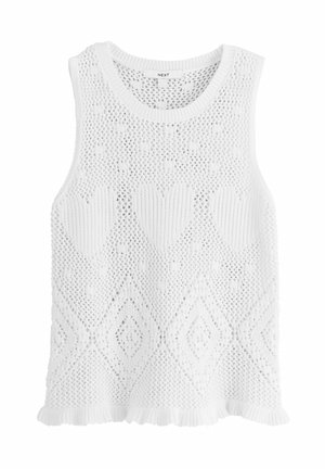 Weißes ärmelloses gestricktes Top mit Herz- und Diamantmustern und einem Rüschensaum, am Kragen mit "Next" gekennzeichnet.