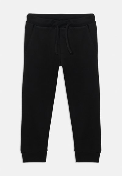 Schwarze Baumwoll-Sweatpants mit elastischem Bund, Kordelzug und zwei Seitentaschen. Enganliegende Bündchen an den Knöcheln. Glatte Textur.