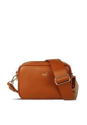 Tan leather crossbody bag with gold hardware, rectangular shape, adjustable strap, and logo accent on the front. Features a zip closure.