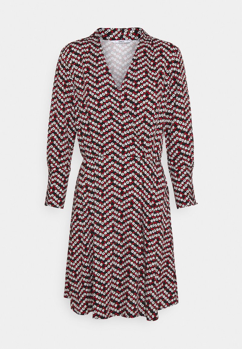 Robe à manches longues avec col en V, motif floral en zigzag rouge, blanc et noir, taille ajustée, longueur au genou sur fond clair.