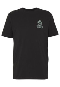 T-shirt noir à manches courtes avec un petit graphique lotus et flamme bleu clair sur la poitrine gauche, présentant un symbole circulaire avec des caractères asiatiques.