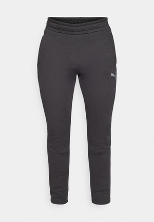 Dark gray sweatpants with a soft texture, tapered fit, elastic waistband, and a small logo on the left thigh. No pockets visible.