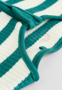 Striped fabric featuring alternating teal and cream colors, with ribbed texture. Rounded edges and secure top fastening detail included.