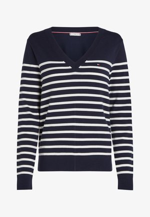 Navy blue V-neck sweater with white horizontal stripes and small embroidered flag logo on the chest. Long sleeves and ribbed cuffs.