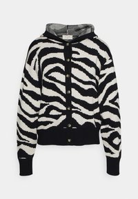Černobílý kardigan se vzorem zebry a kapucí, s knoflíkovou légou vpředu a žebrovanými manžetami a lemem. Měkký pletený materiál.